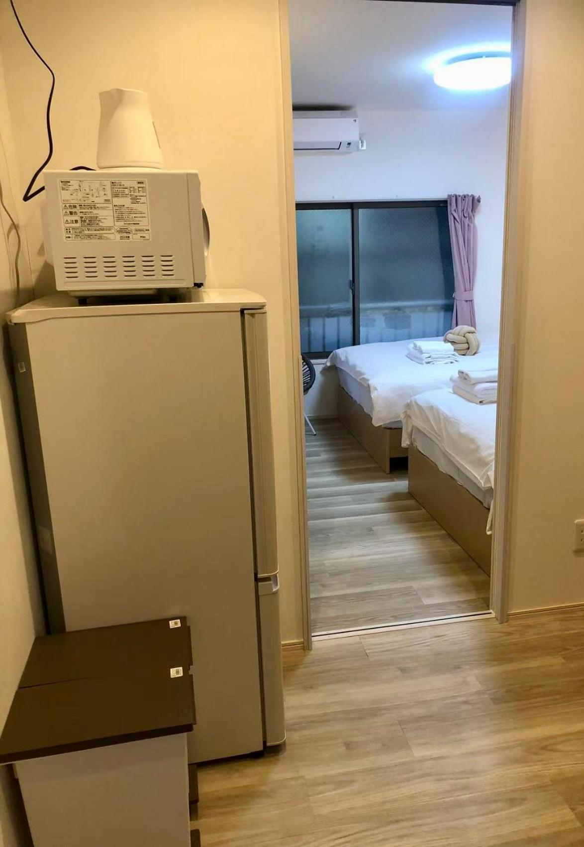 Kosumosu Wisma tamu Tokyo